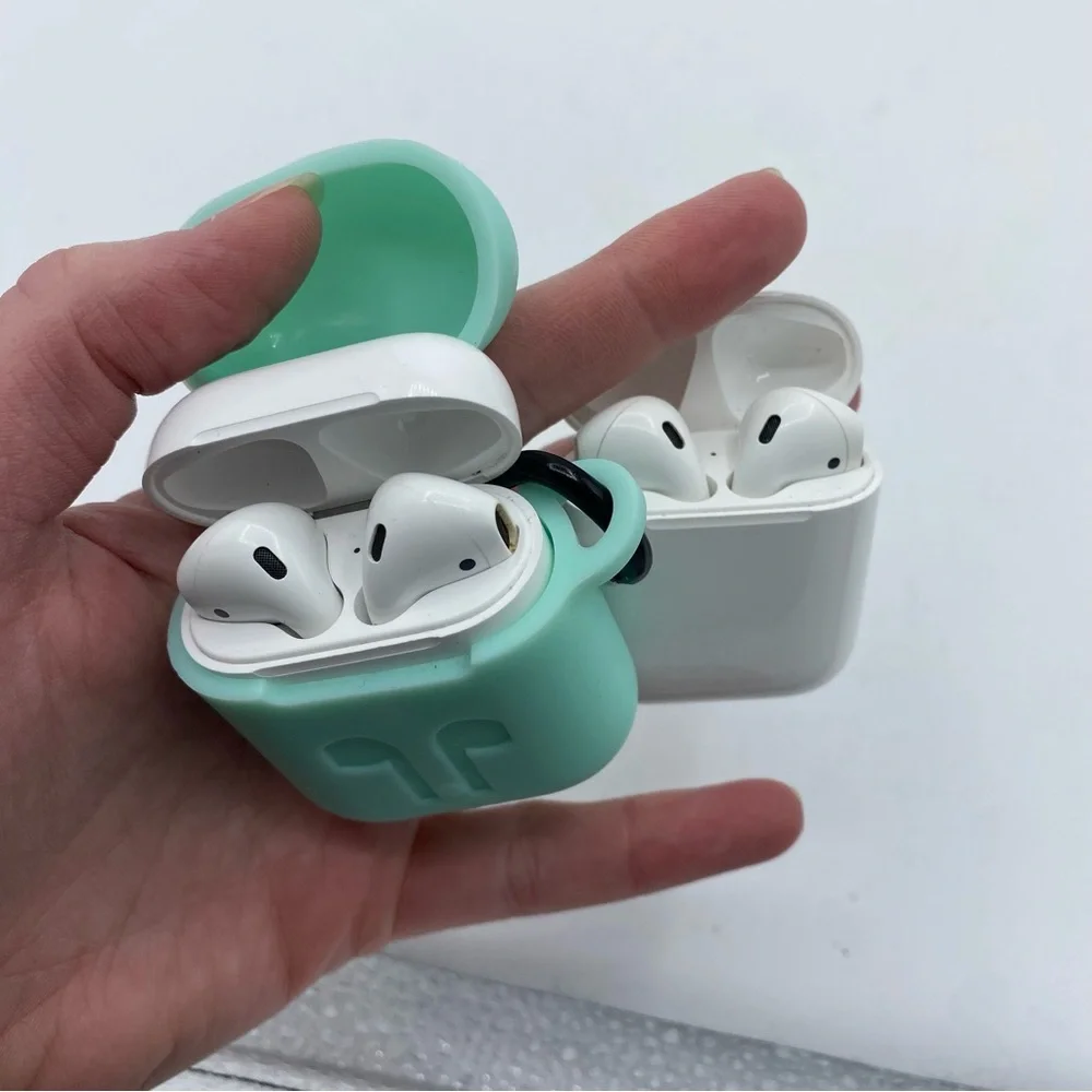 2 pairs of AirPods and charging‎ cases AS IS UNTESTED